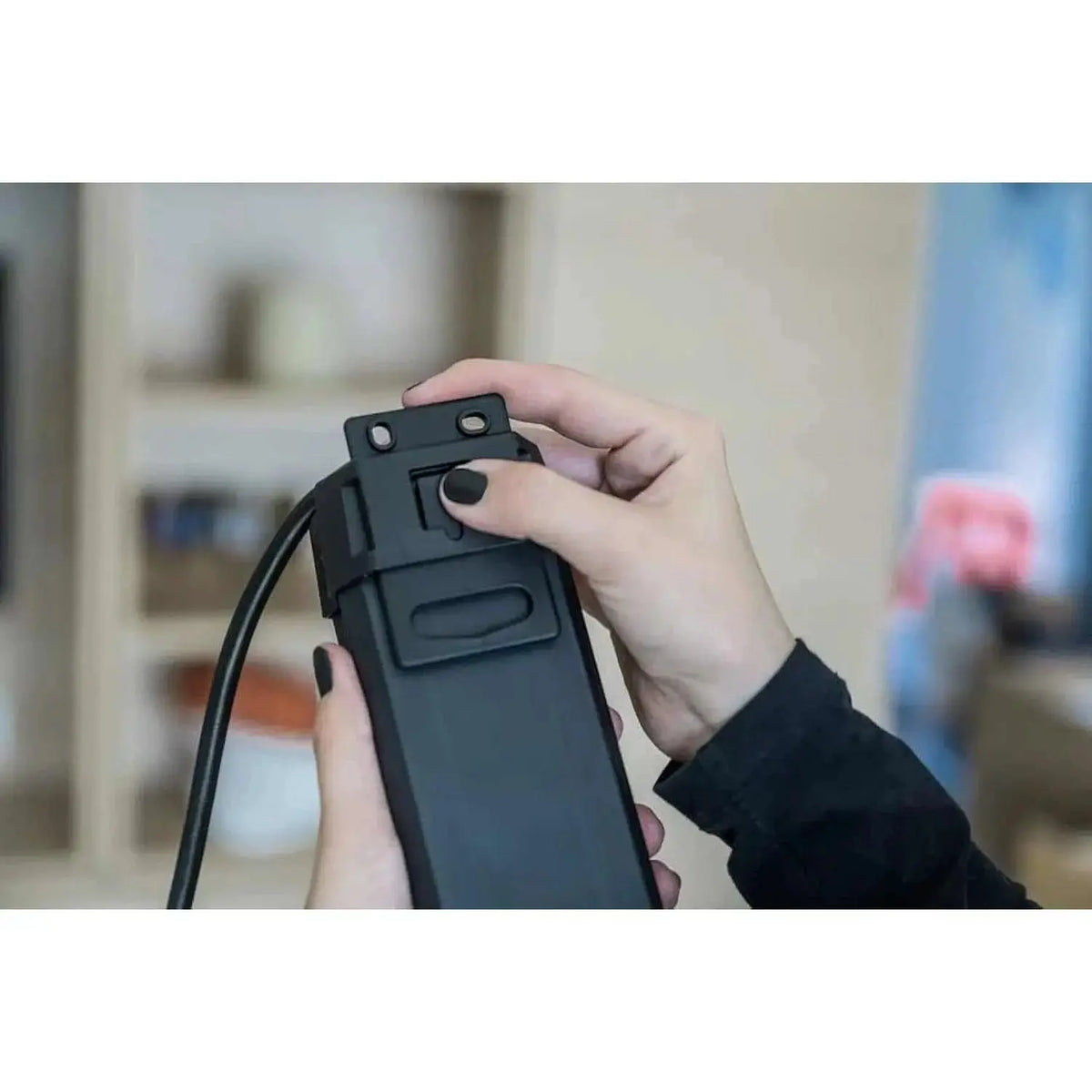 Brennenstuhl Premium Line 5-way Extension Cord 3m close-up of black power strip with cable and mounting bracket being adjuste