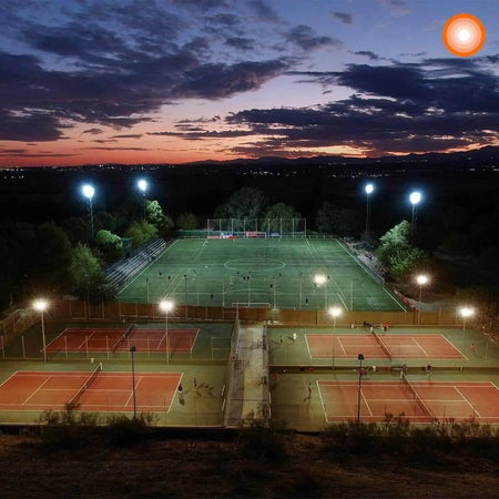 Ledvance LED Eco Lite Floodlight 50W G2 IP65 mounted on tall poles lighting a dusk sports complex UAE