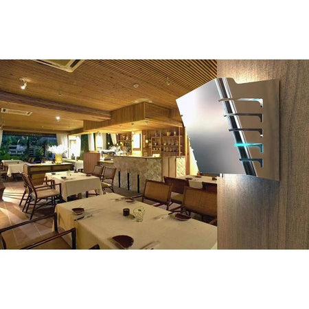 Mo-el Cri Cri 398R 20W stainless steel UV-A wall-mounted insect killer on a restaurant wall; dining room visible. UAE